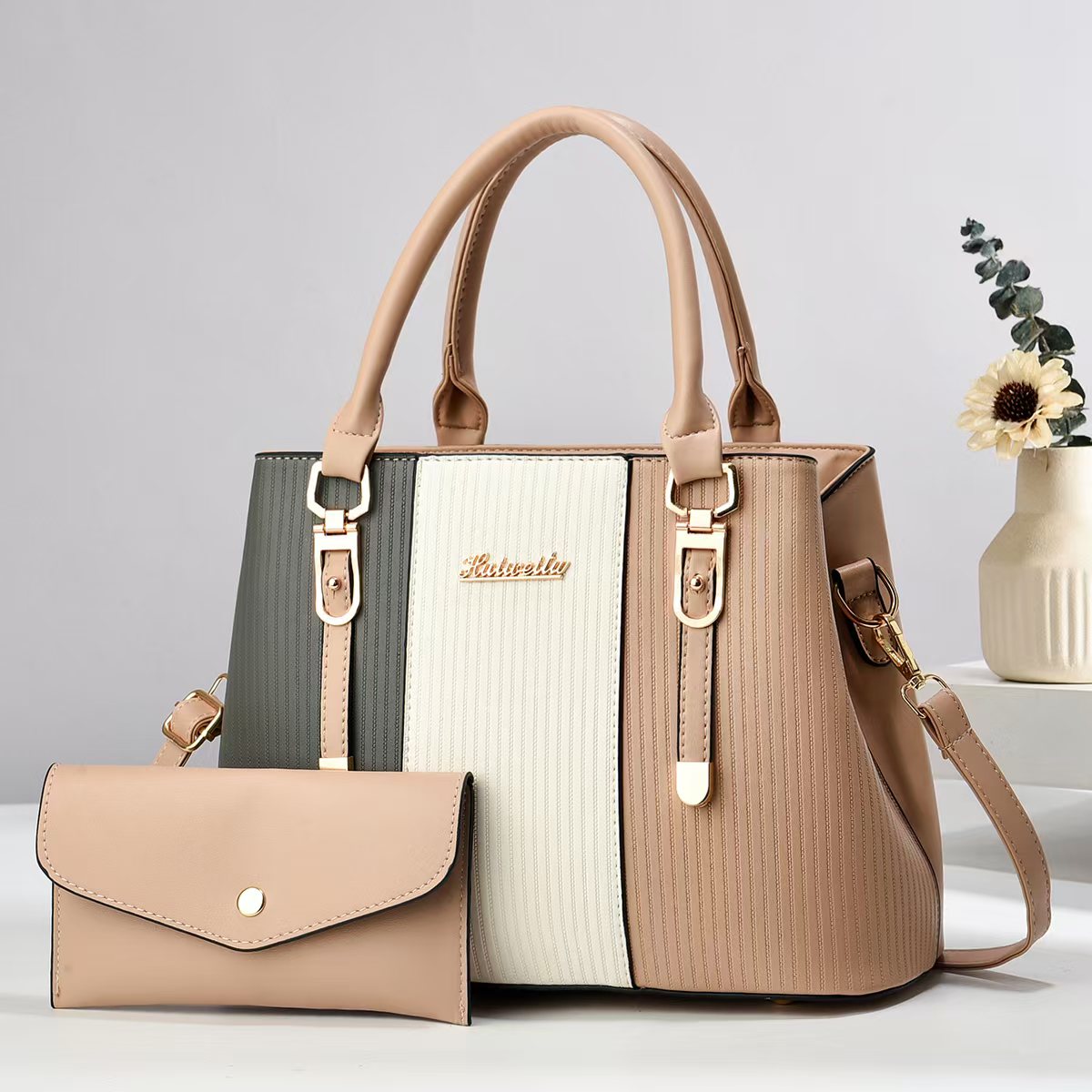 Color-blocked women's handbag, trendy and fashionable, made of PU material, suitable for shoulder or crossbody use, large capacity.